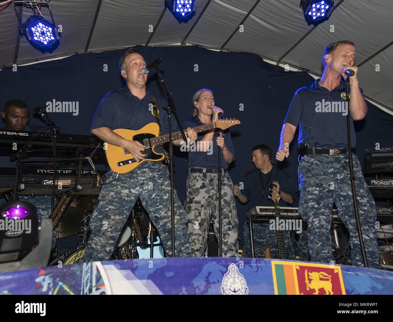 180506-N-FL910-0098 TRINCOMALEE, Sri Lanka (May 6, 2018) Service members assigned to the U.S. Pacific Fleet Band perform at Ehambaran Sport Ground in support of Pacific Partnership 2018 (PP18), May 6, 2018. PP18's mission is to work collectively with host and partner nations to enhance regional interoperability and disaster response capabilities, increase stability and security in the region, and foster new and enduring friendships across the Indo-Pacific Region. Pacific Partnership, now in its 13th iteration, is the largest annual multinational humanitarian assistance and disaster relief prep Stock Photo