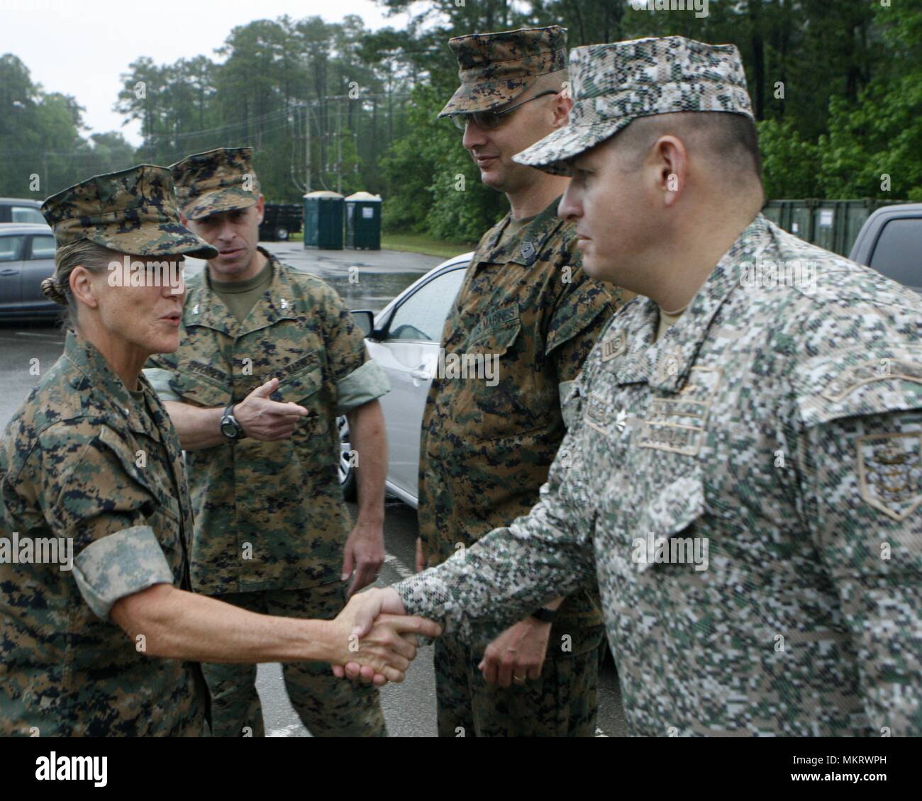 Brigadier Gen. Helen S. Pratt, the 4th Marine Logistics Group commander, greets Colombian Lt. Col. Erick Del Rio, the deputy commander of Special Purpose Marine Air-Ground Task Force - Southern Command, during her visit to Camp Lejeune, North Carolina, May 6, 2018, May 6, 2018. The SPMAGTF is preparing to deploy to Central and South America in June to conduct tailored training and engineering projects alongside security forces in these regions, and will be on standby to provide humanitarian assistance and disaster relief in the event of an emergency. (U.S. Marine Corps photo by Staff Sgt. Fran Stock Photo
