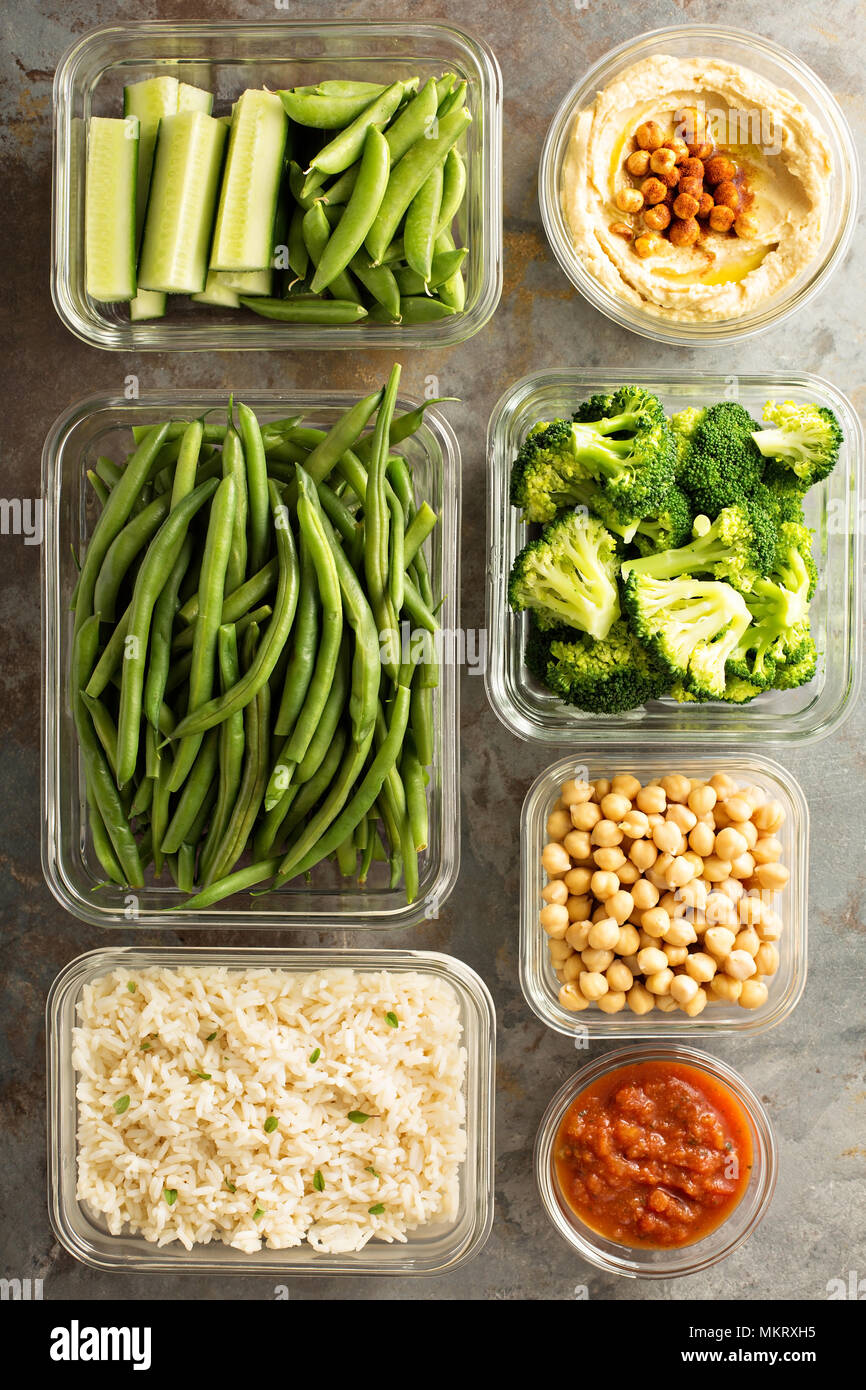 Vegan meal prep with cooked rice, chickpeas and vegetables Stock Photo