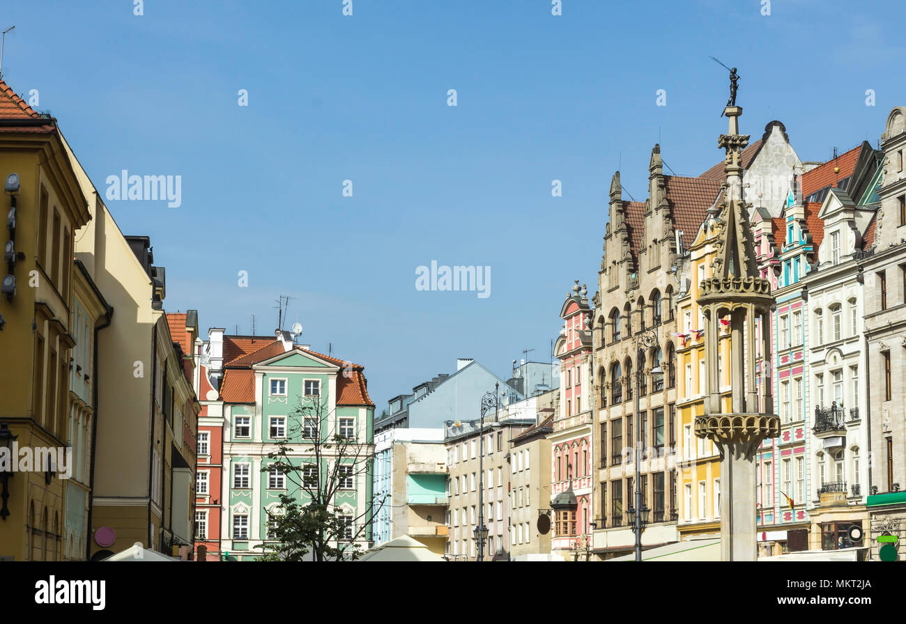 Refurbished buildings. Facades of buildings around the market square. Gothic and baroque details and building elements. Old Town in Wroclaw, Poland. Stock Photo