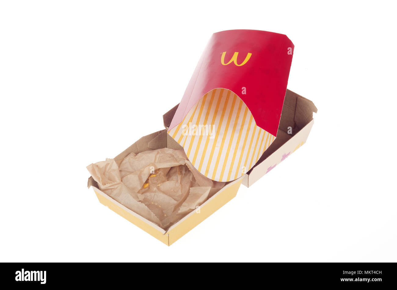 Empty McDonald’s quarter pounder cheeseburger box and empty large fries container on white background Stock Photo
