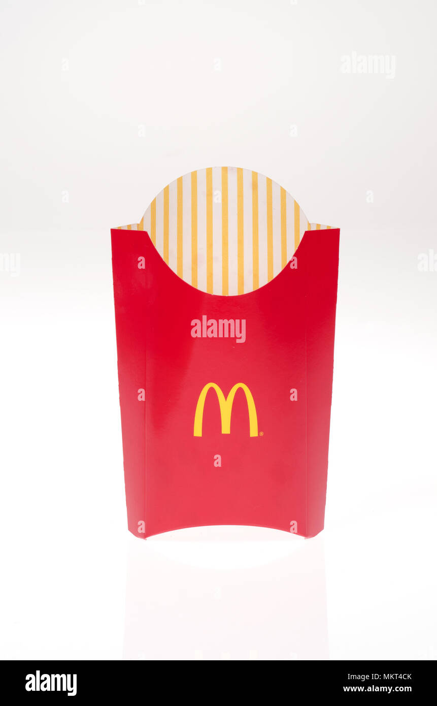 Empty Mcdonald’s french fries container on white background Stock Photo