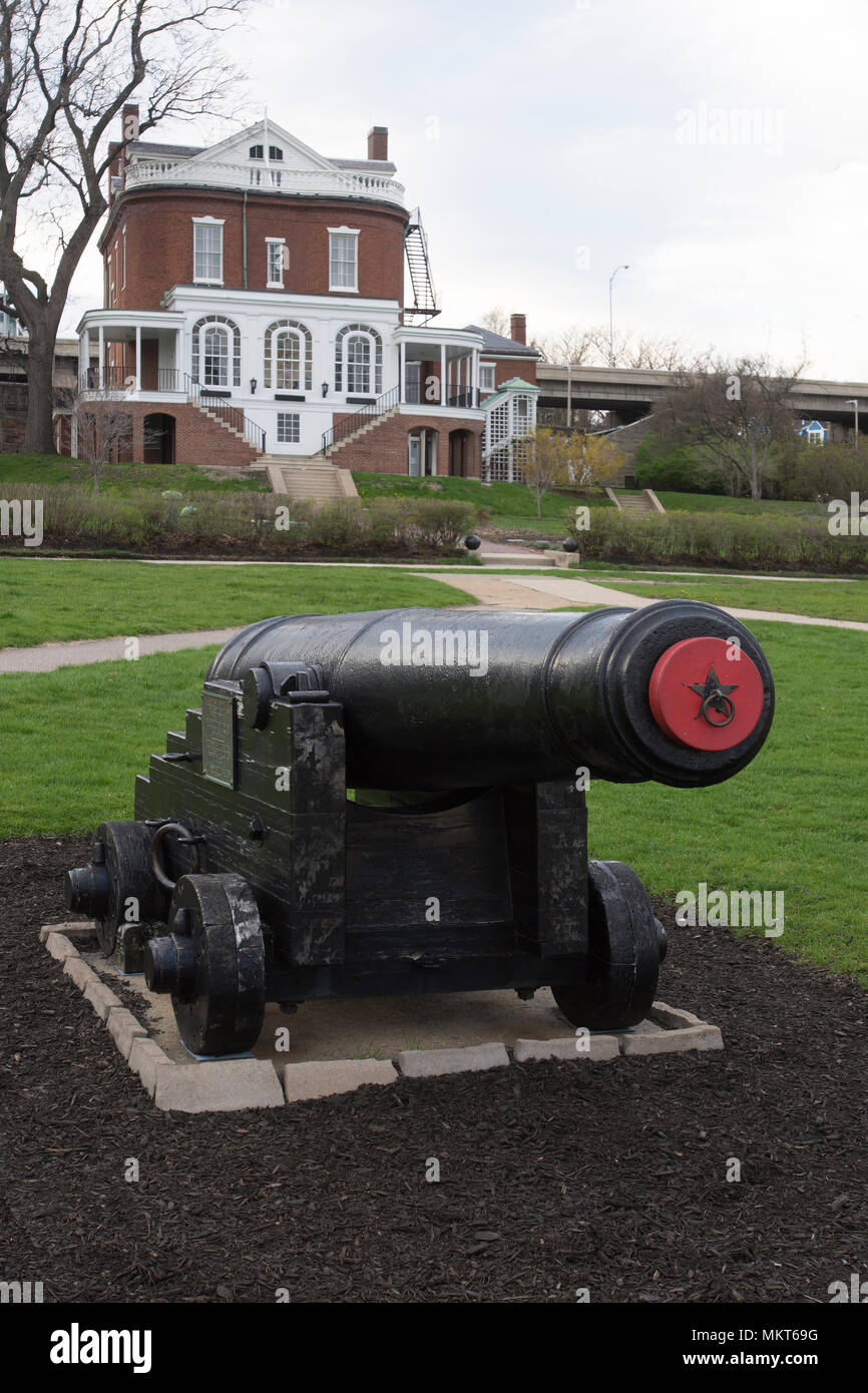 A 19th century cannon adorns the lawn of the Commandant's House in the former Charlestown Navy Yard in Boston, Massachusetts, USA Stock Photo