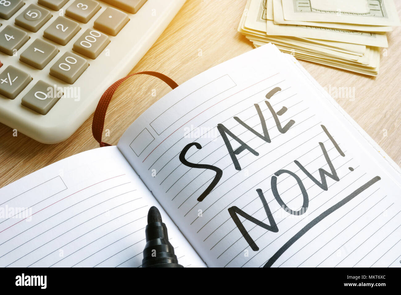 Words save now at a page. Savings concept Stock Photo - Alamy