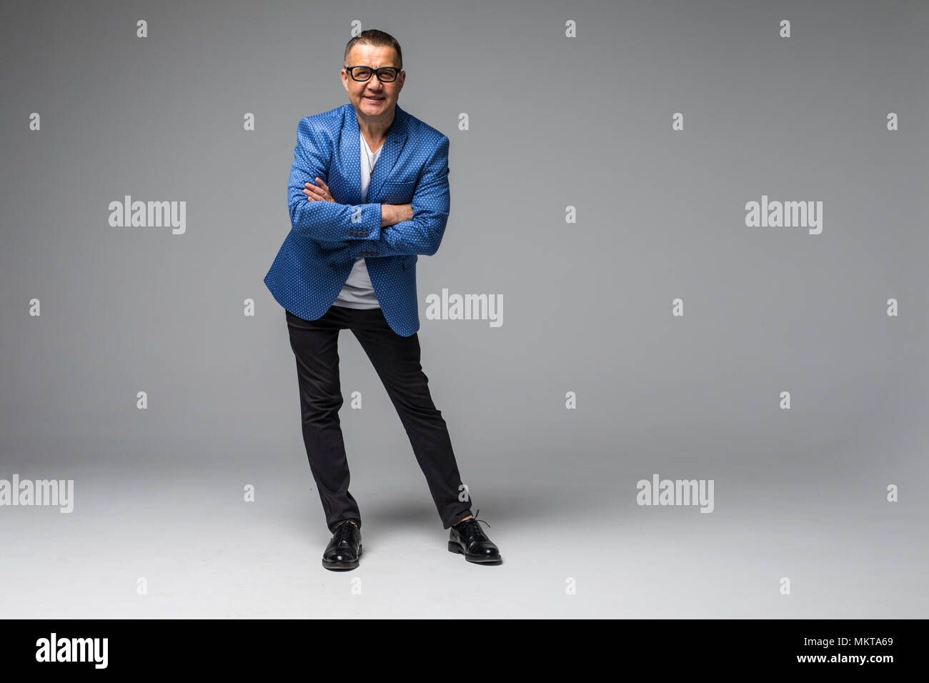 Full length portrait of confident mature businessman in formals ...