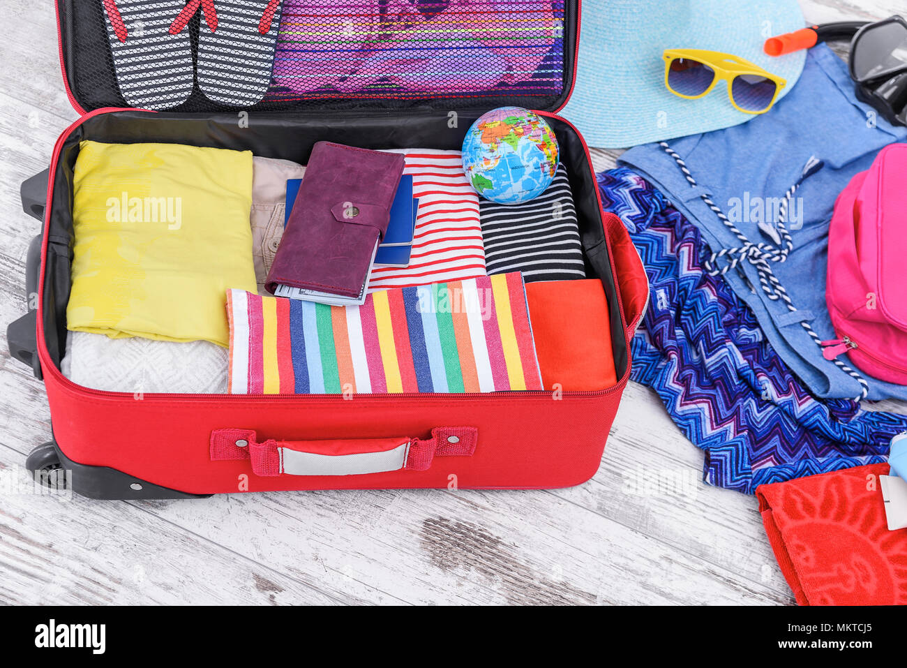 Suitcase with things on the floor. Stock Photo