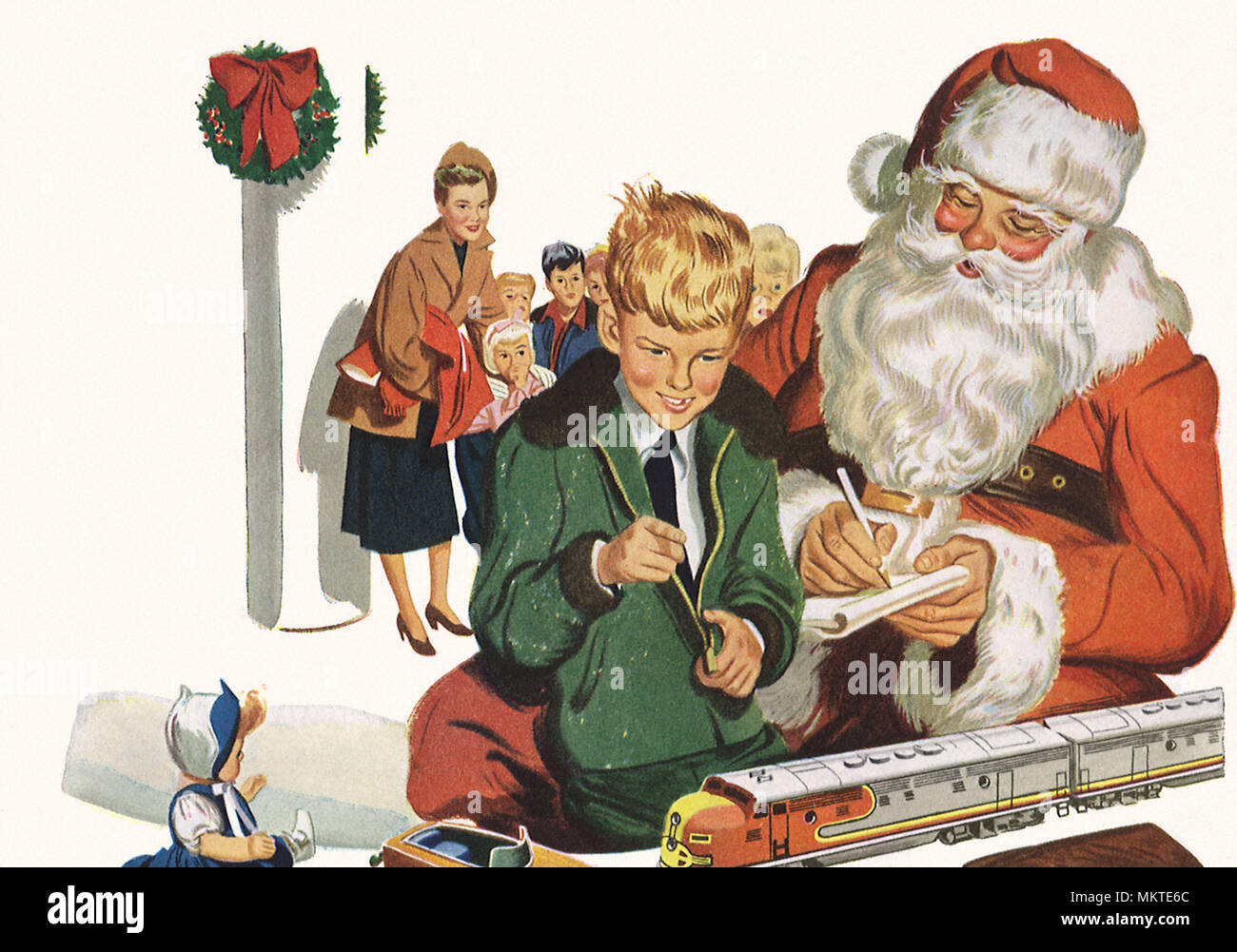 Santa and Boy looking at Toys Stock Photo - Alamy