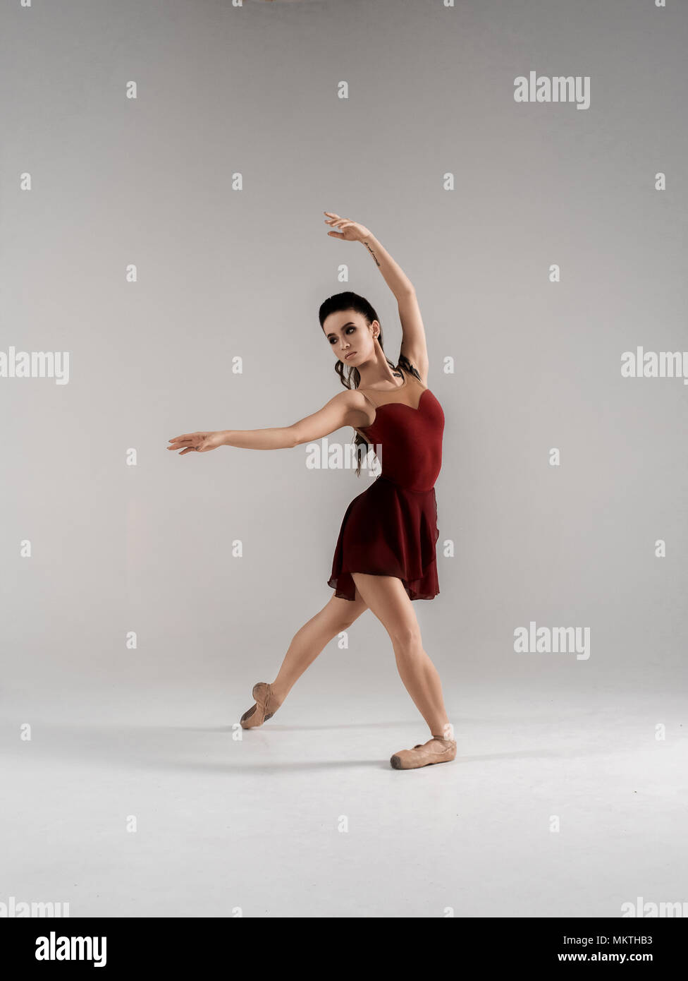 Modern ballet dancer, ballerina performing art jump with empty copy space background, izolated space. Healthy Life And Sport Consept. Stock Photo