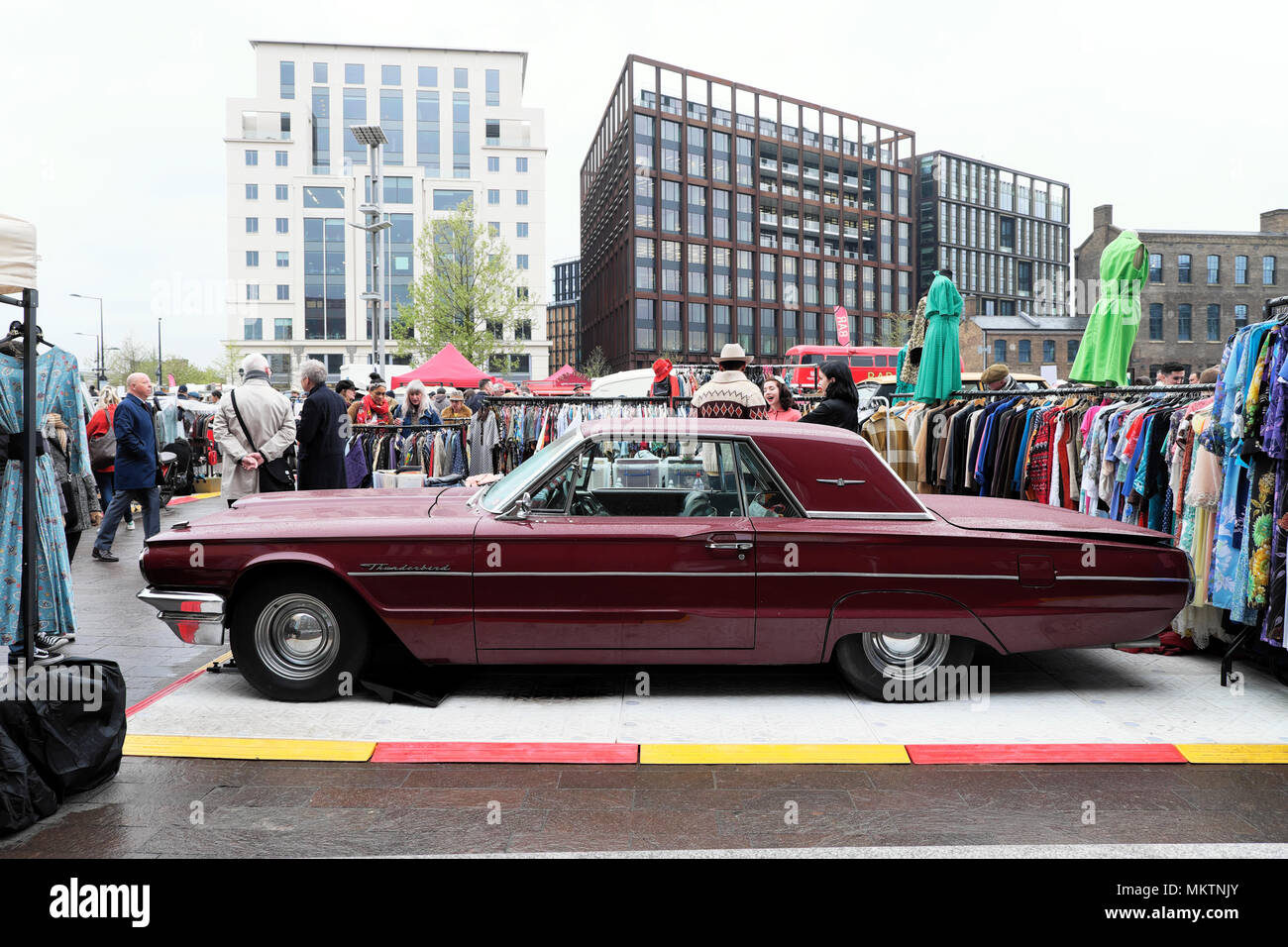 Vintage car boot fair sale and maroon Ford Thunderbird car at Granary