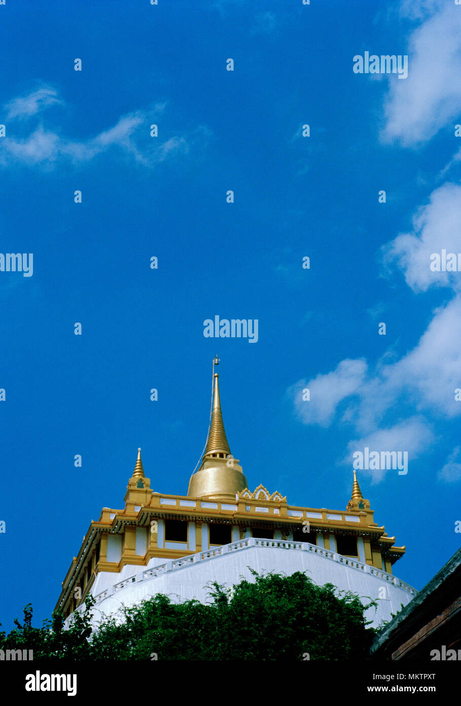 Golden Mount - Buddhist shrine of Wat Saket Ratcha Wora Maha Wihan Golden Mountain Temple in Bangkok in Thailand in Southeast Asia Far East. Sky Stock Photo