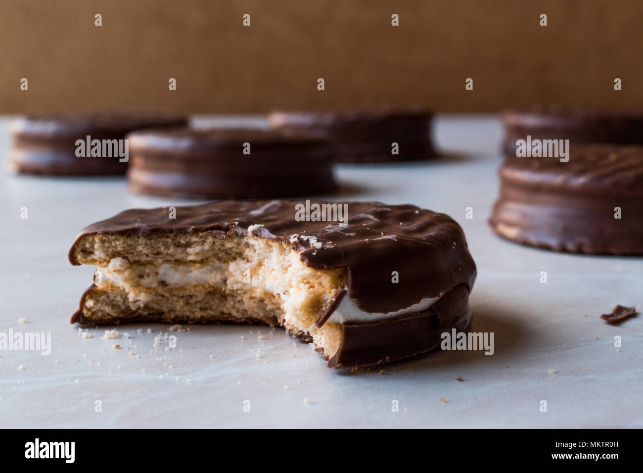 Stack of Bitten Chocolate Covered Marshmallow Biscuits. Dessert Concept. Stock Photo