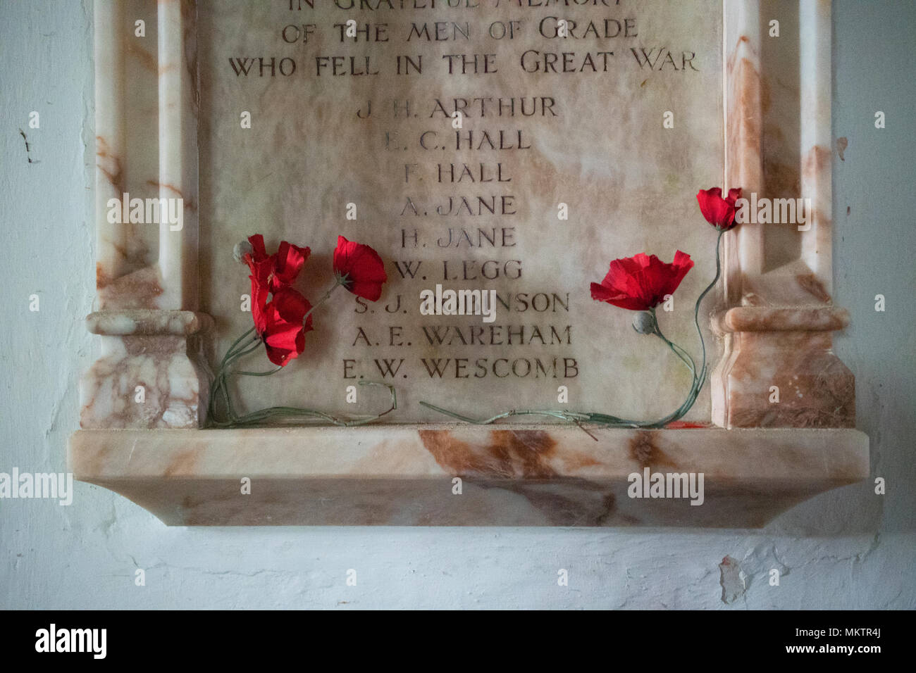 Artificial poppies on a Great War memorial - John Gollop Stock Photo