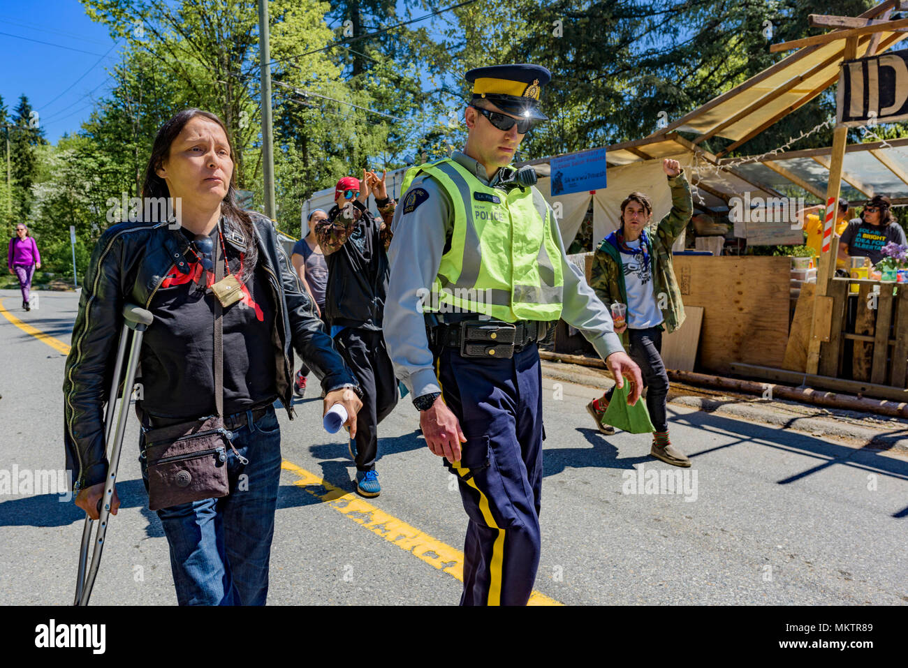 Protester Kat Roivas is arrested for the 3rd time standing against the Kinder Morgan Pipeline twinning and expansion, Burnaby Mountain, British Columb Stock Photo