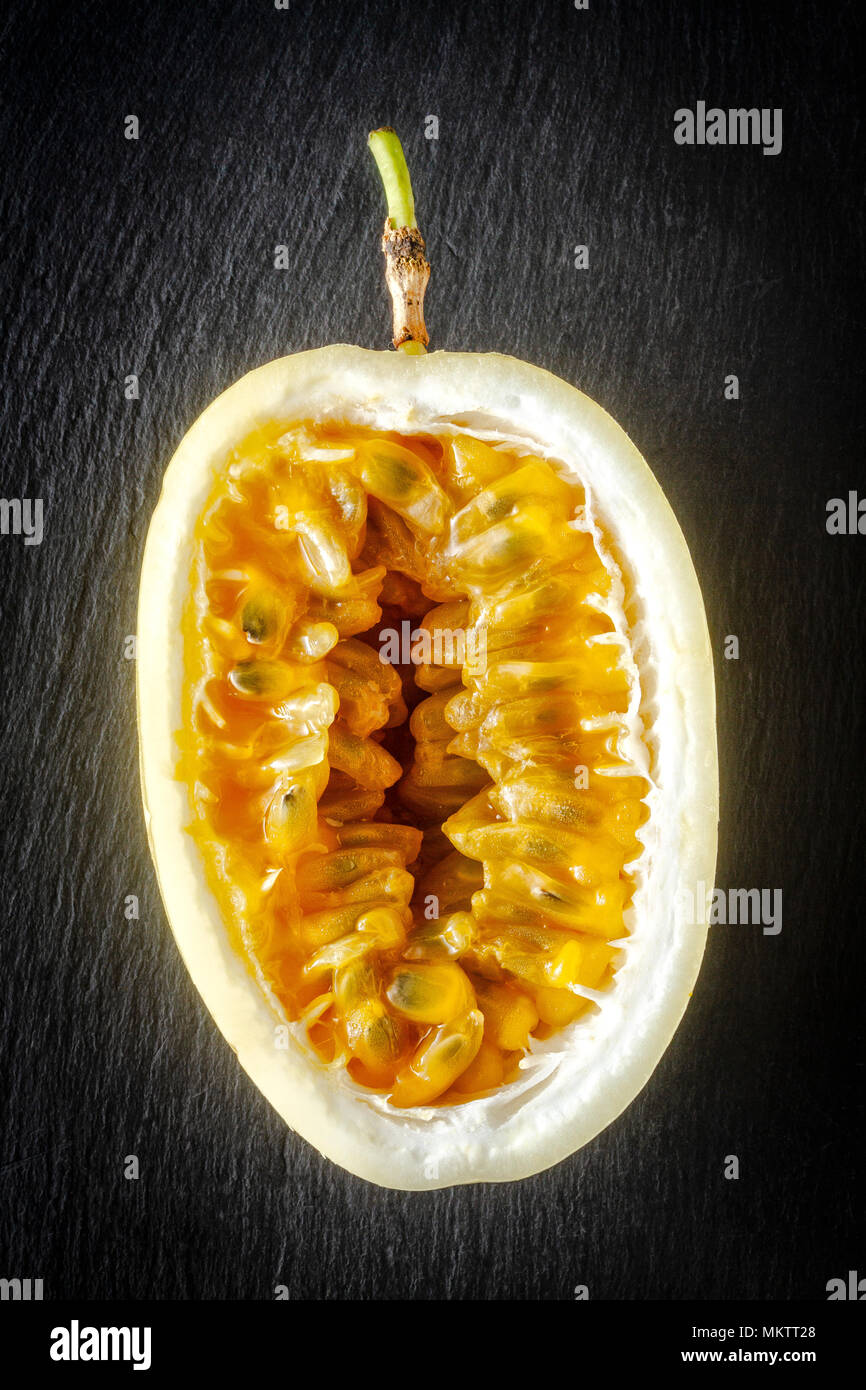 Passion fruit cut in half Stock Photo Alamy