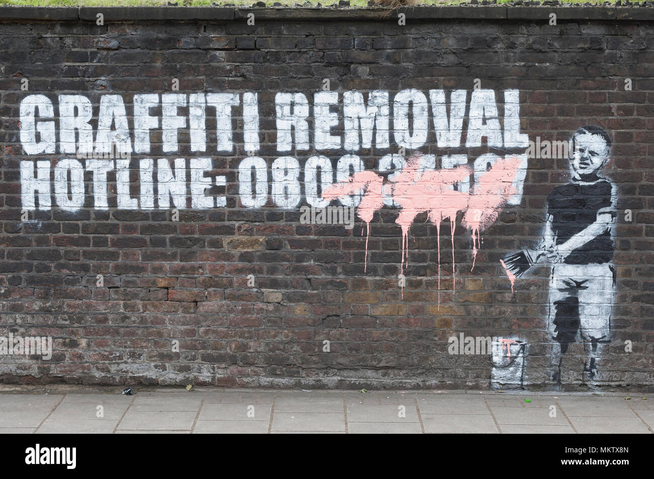Banksy's 'Graffiti Removal Hotline' Pentonville Road, London, N1, Britain. Stock Photo