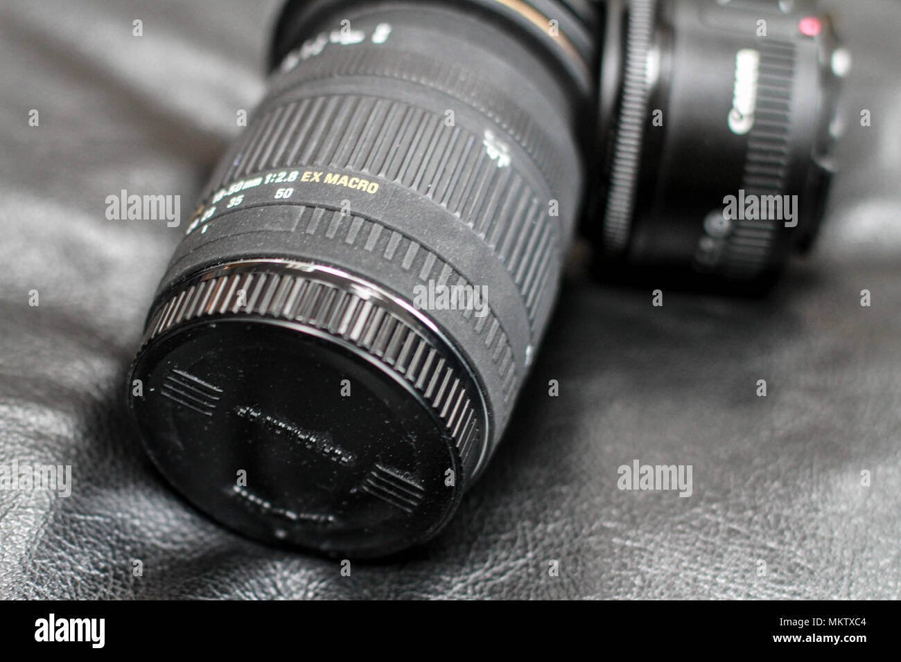 Old dusty canon zoom lens, with covers Stock Photo Alamy