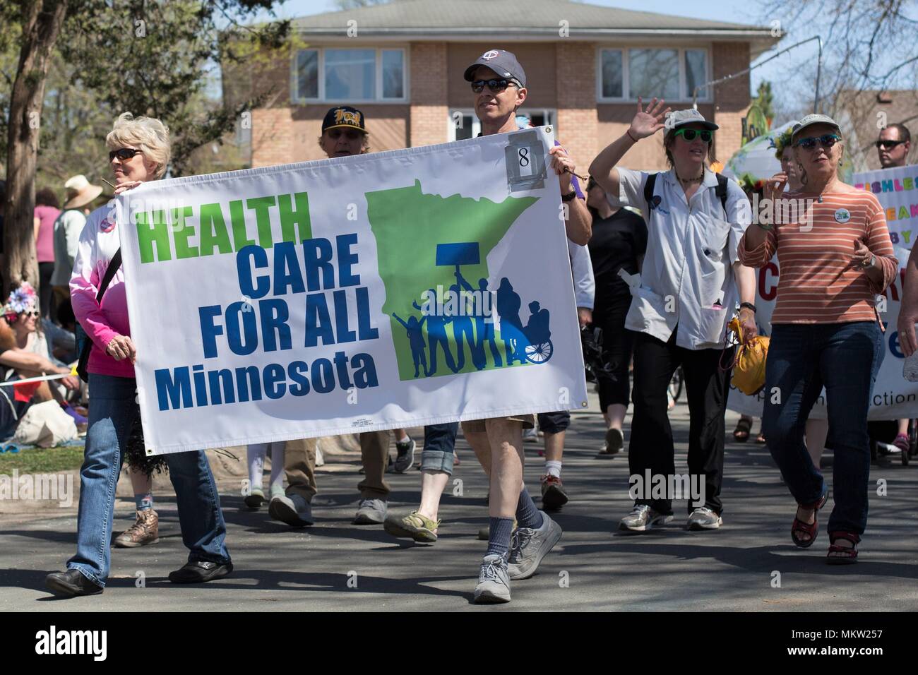 Advocates for health care for all marching at the May Day parade and festival in Minneapolis, Minnesota, USA. Stock Photo