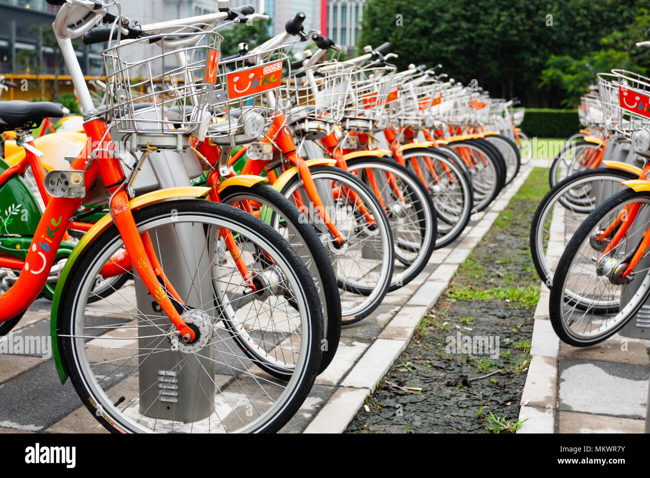 Public bicycles parking at YouBike (U Bike) Bike Sharing Station, Zhongxin Plaza, Xinyi District, Taipei City, Taiwan Stock Photo