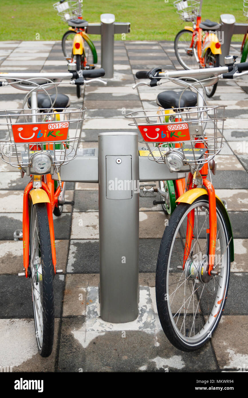 Public bicycles parking at YouBike (U Bike) Bike Sharing Station, Zhongxin Plaza, Xinyi District, Taipei City, Taiwan Stock Photo