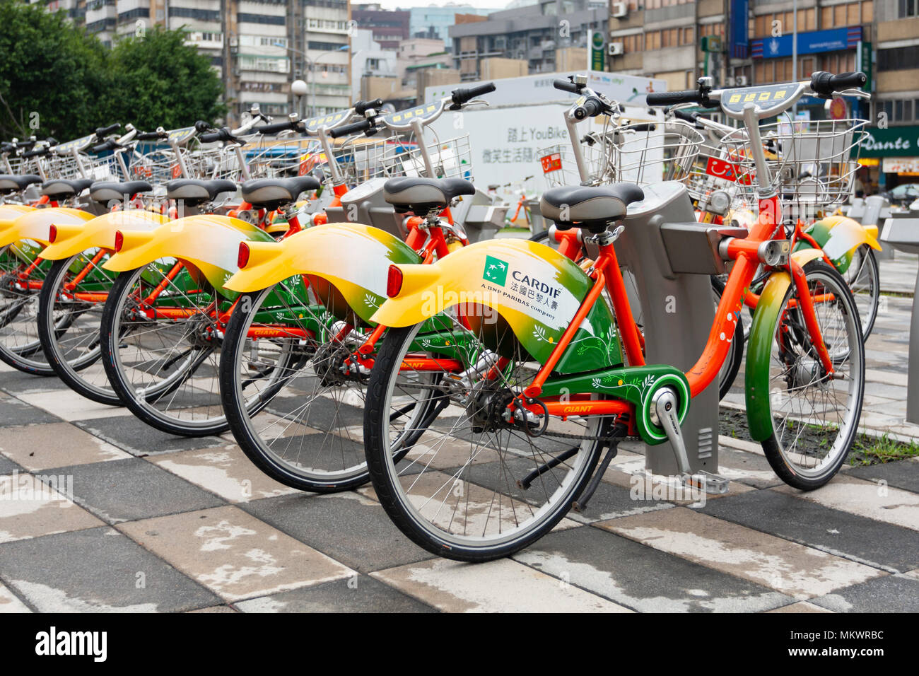 Public bicycles parking at YouBike (U Bike) Bike Sharing Station, Zhongxin Plaza, Xinyi District, Taipei City, Taiwan Stock Photo