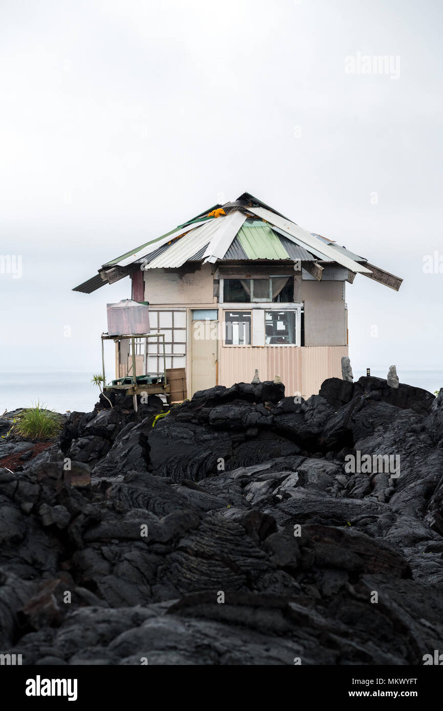 A temporary house stands in the lava fields in the former town of Kalapana in the Puna District on the Big Island of Hawaii. The town was destroyed by Stock Photo
