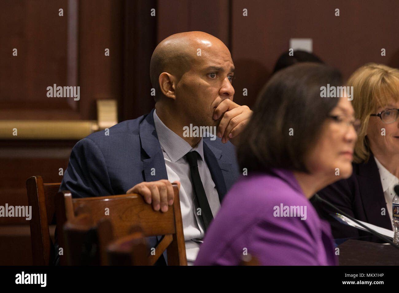 Senator Cory Booker (D-NJ) listens to testimony at a meeting held by Senate Democrats to hear testimony from constituents on the ACHA on May 10th, 2017 at the U.S. Capitol. Stock Photo