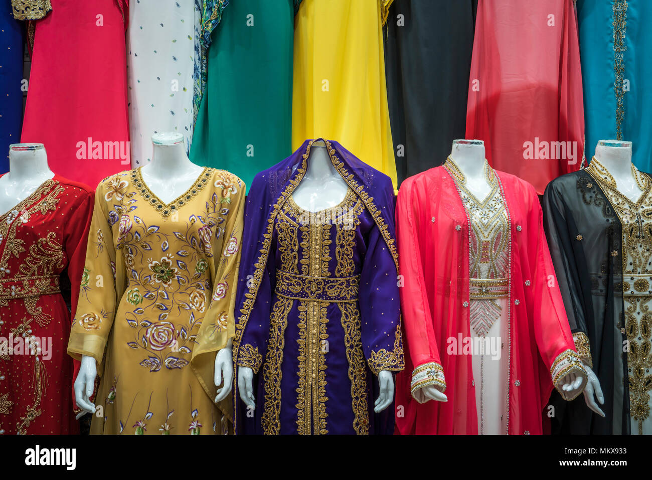 Clothes and textiles for sale in the textile markets of old town Dubai UAE,  Middle East Stock Photo - Alamy