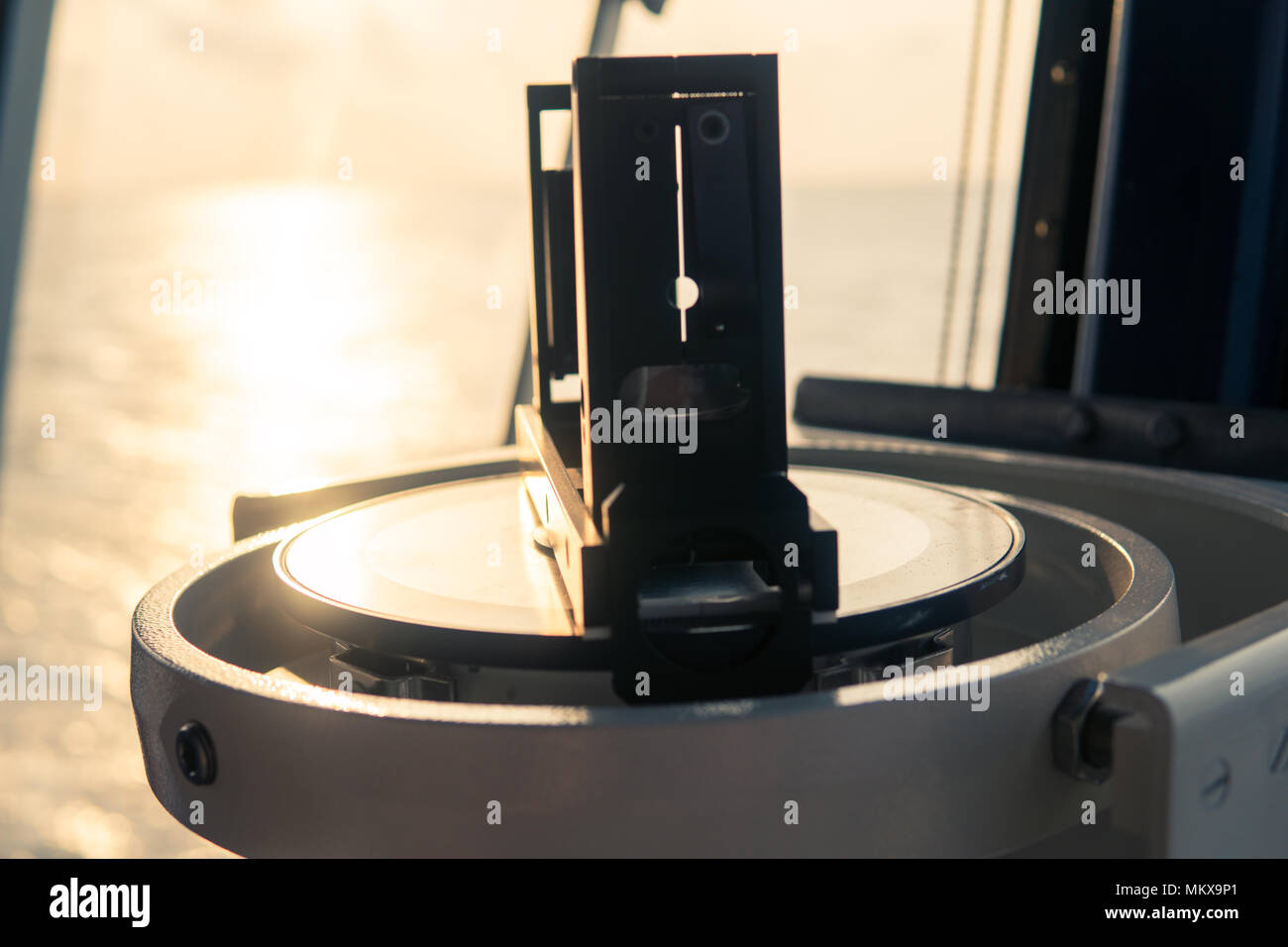 Close up of nautical marine compass on yacht or boat Stock