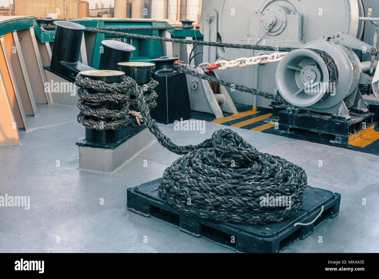 mooring equipment of ship. Mooring lines are fast on bollards, capstan and winch Stock Photo Alamy