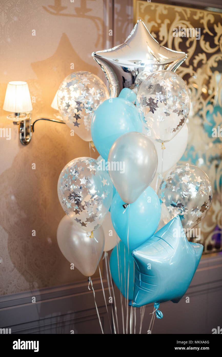 birthday photo zone with white, blue and transparent balloons, free space. Colorful balloons background, Stock Photo