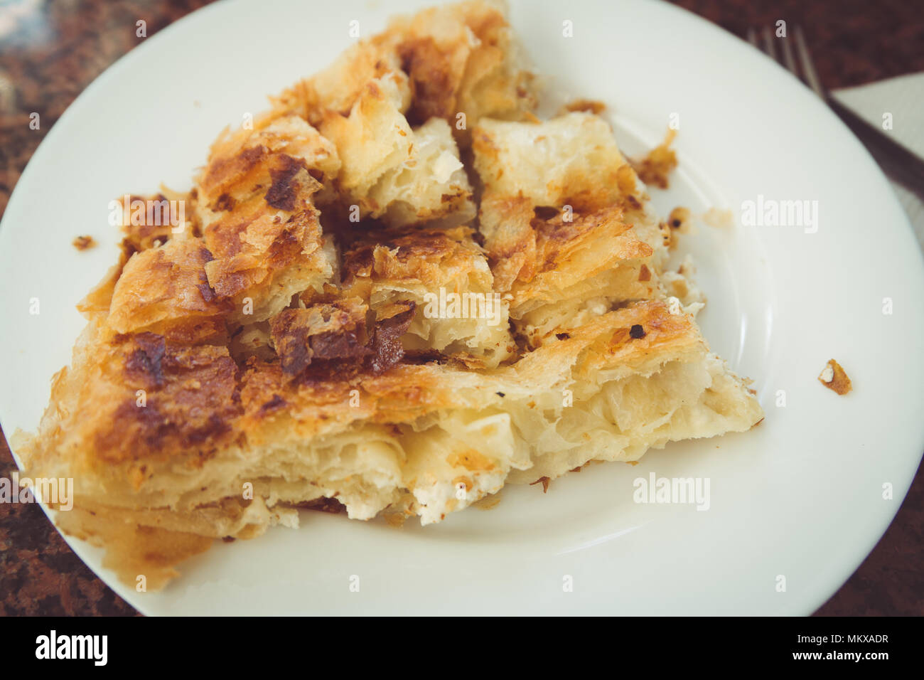 Balkan Bakery Breakfast Serving of Byrek me Gjizë (Cheese Pie with Feta & Flaky Filo Pastry) Burek Stock Photo