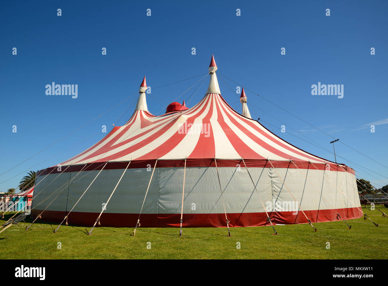 Colourful circus tent against a blue sky Stock Photo - Alamy