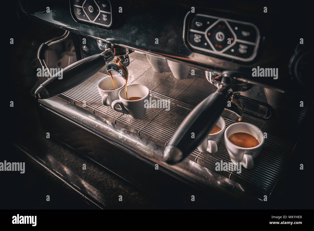 Espresso pouring from coffee machine. Professional coffee brewing Stock Photo
