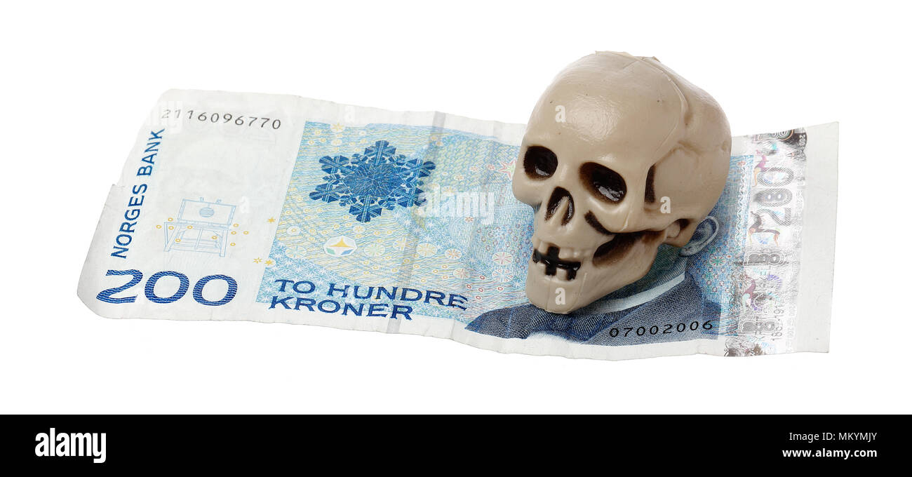 Norwegian 200 kroner bill with a small plastic scull isolated on white background. Stock Photo
