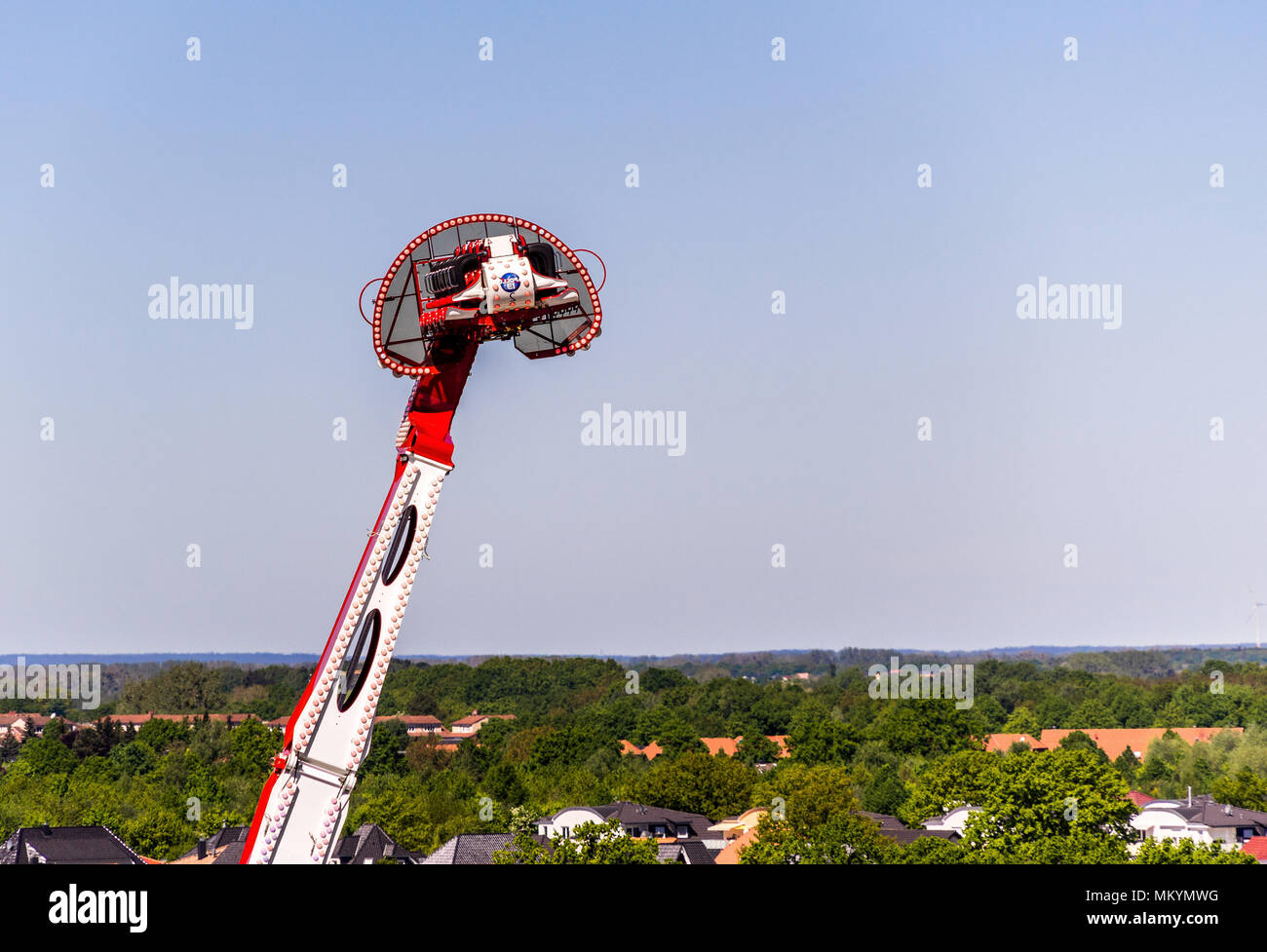 Wolfsburg, Lower Saxony, May 5, 2018: Huge ride called 'Apollo 13' at a funfair shortly before its turning point at a height of 55 meters, with the ou Stock Photo