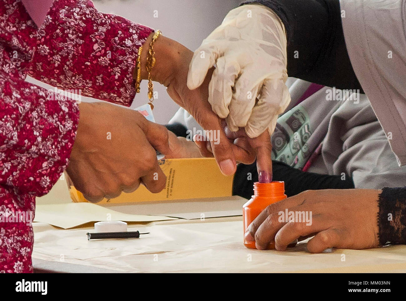 A Women Seen Dip Her Finger In The Ink At A Polling Station During The Election Day In Malaysia Millions Of Malaysia Citizens Casted Their Vote For 14th General Election On Wednesday