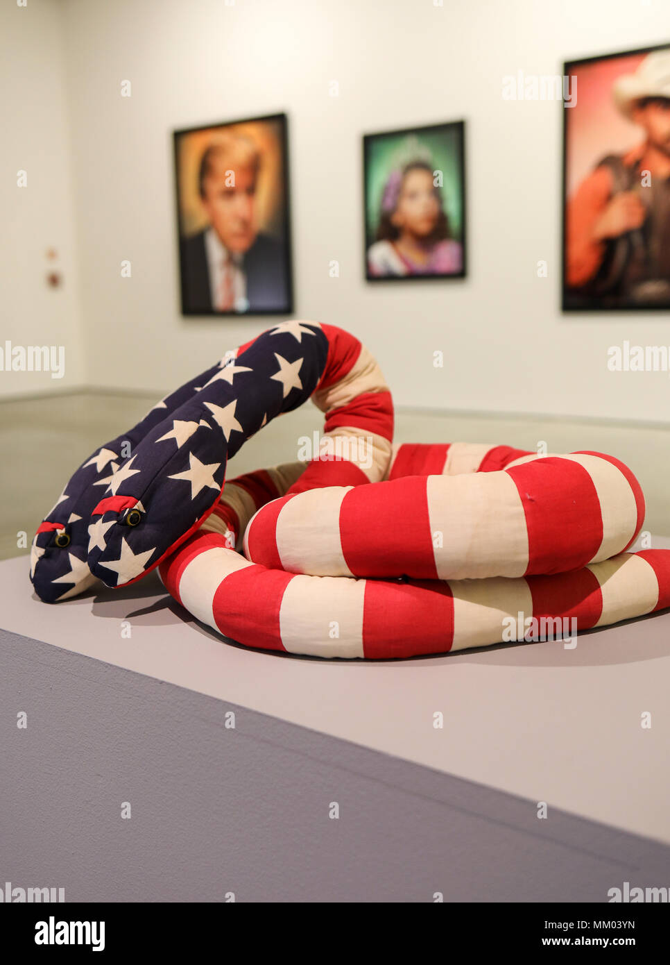Cracow, Poland - May 8, 2018: Exibition Motherland in Art at Mocak in Krakow. Melissa Vanderberg - Polycephalic Patriot. Two-headed plush snake, made from pieces of flags is a criticism of a two party politicial system Credit: Wieslaw Jarek/Alamy Live News Stock Photo