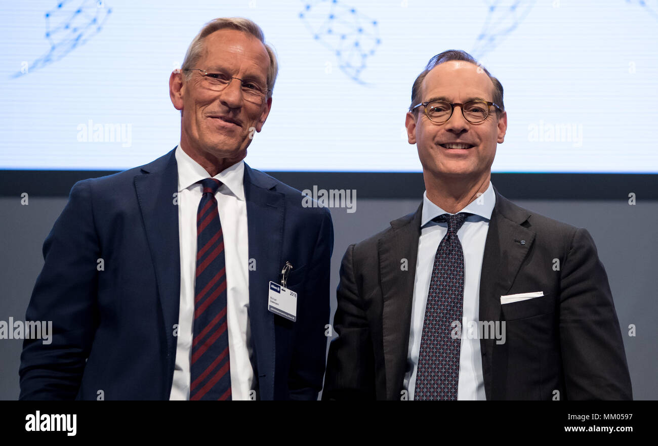 09 May 2018, Germany, Munich: CEO of the insurance company Allianz SE, Oliver Baete (R), and chairman of the board Michael Diekmann standing onstage before the begin of the annual general meeting of the insurance company Allianz. Photo: Sven Hoppe/dpa Stock Photo