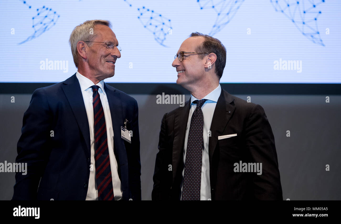 09 May 2018, Germany, Munich: CEO of the insurance company Allianz SE, Oliver Baete (R), and chairman of the board Michael Diekmann standing onstage before the begin of the annual general meeting of the insurance company Allianz. Photo: Sven Hoppe/dpa Stock Photo