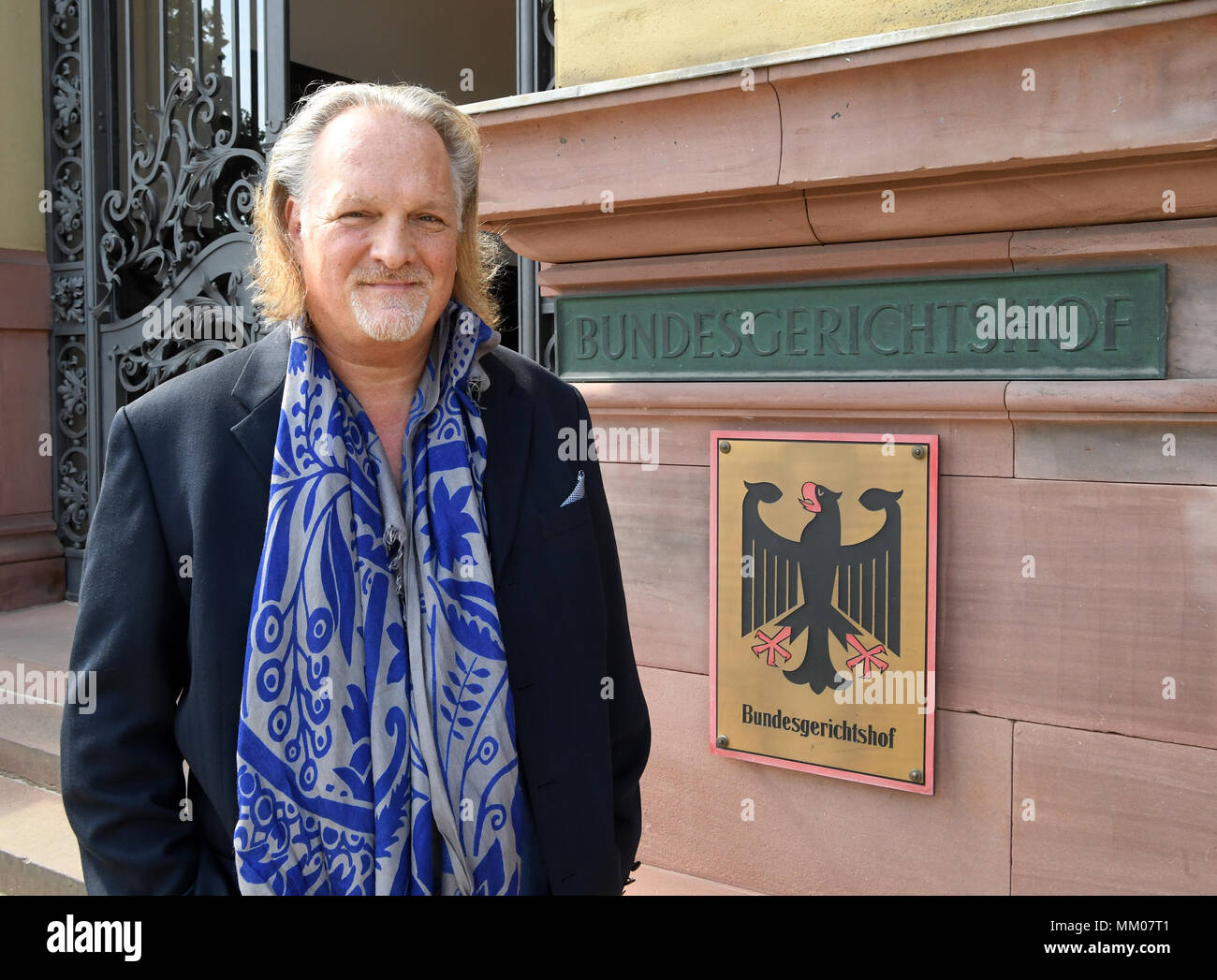 09 May 2018, Germany, Karlsruhe: The music producer Frank Peterson waiting for the begin of the trial in front of the Federal Supreme Court. The Federal Supreme Court is negotiating whether the music platform Youtube bears liability for copyright infringements of their users. A music producer has been suing the Google subsidiary for ten years. Photo: Uli Deck/dpa Stock Photo