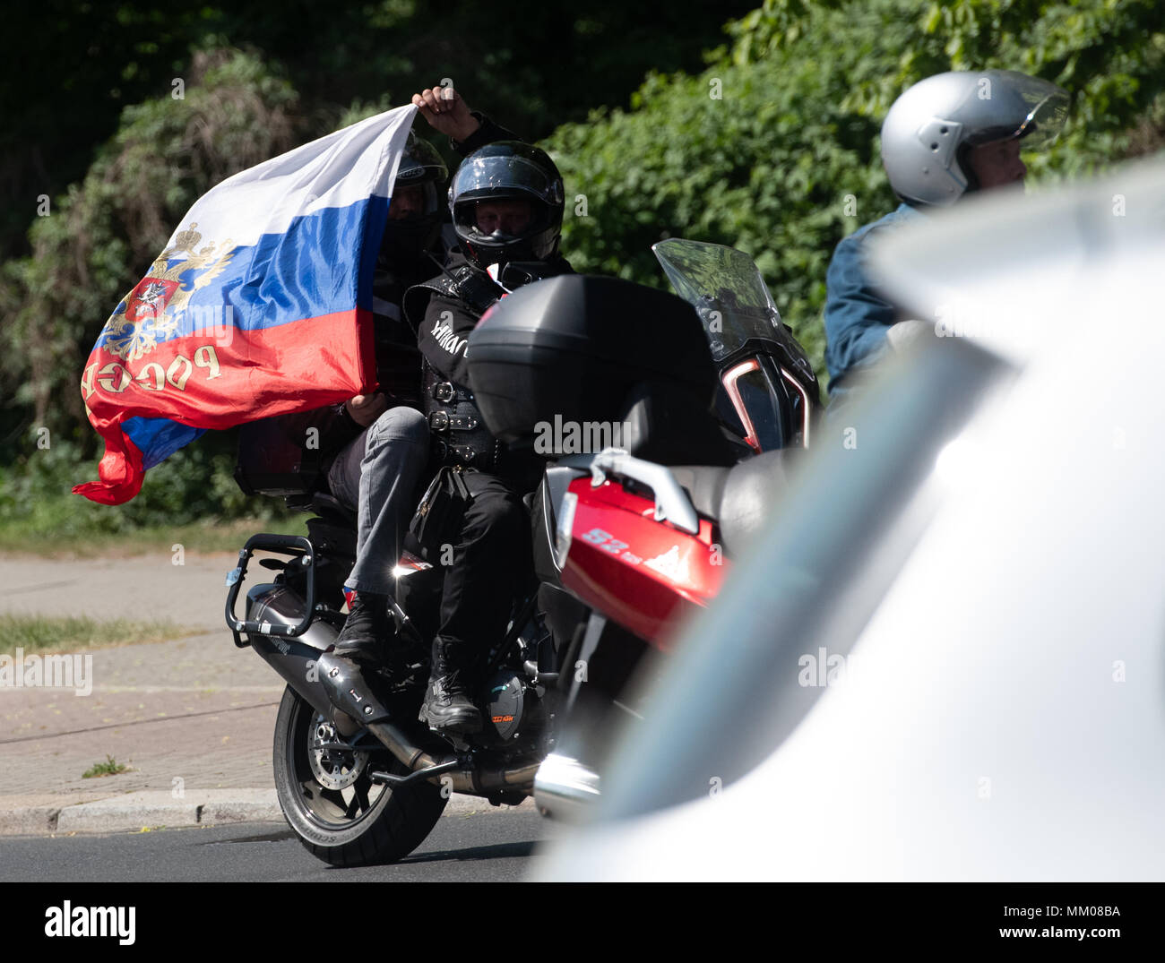 09 May 2018, Germany, Berlin: The Russian motorcycle gang 'Night Wolves' driving through Berlin on 'Victory Day'. Russia and the other former Soviet republics pay tribute to the victory over Hitler's Germany of 1945 on 09 May. Photo: Paul Zinken/dpa Stock Photo