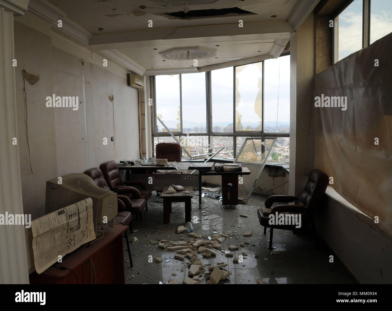 Damascus. 9th May, 2018. Photo taken on May 9, 2018 shows the damage inside an office in the Damascus Tower building in the Marjeh area in Damascus, capital of Syria. At least 4 people were killed and 24 others wounded when rockets targeted Maysat and the Marjeh area in the heart of the capital Damascus Wednesday, according to state news agency SANA. Credit: Ammar Safarjalani/Xinhua/Alamy Live News Stock Photo