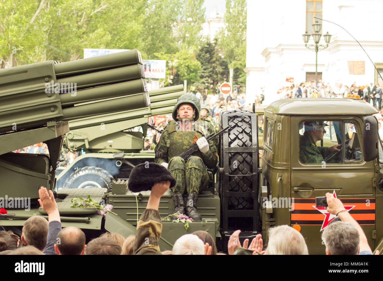 DONETSK, Donetsk People Republic. May 9, 2018: Soviet anti-air gun track with gunners on the main street of the Donetsk city during the Victory Day Parade.DONETSK, Donetsk People Republic. May 9, 2018: Soviet artillery MLRS BM-21 Grad on the main street of the Donetsk city during the Victory Day Parade. Credit: An147/Alamy Live News Stock Photo