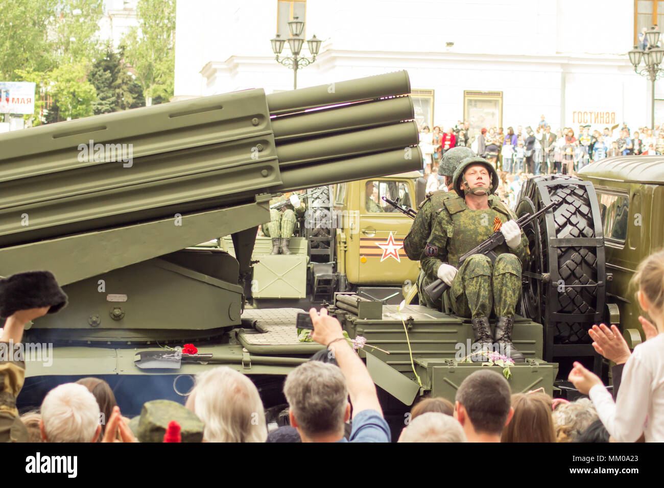 DONETSK, Donetsk People Republic. May 9, 2018: Soviet anti-air gun track with gunners on the main street of the Donetsk city during the Victory Day Parade.DONETSK, Donetsk People Republic. May 9, 2018: Soviet artillery MLRS BM-21 Grad on the main street of the Donetsk city during the Victory Day Parade. Credit: An147/Alamy Live News Stock Photo