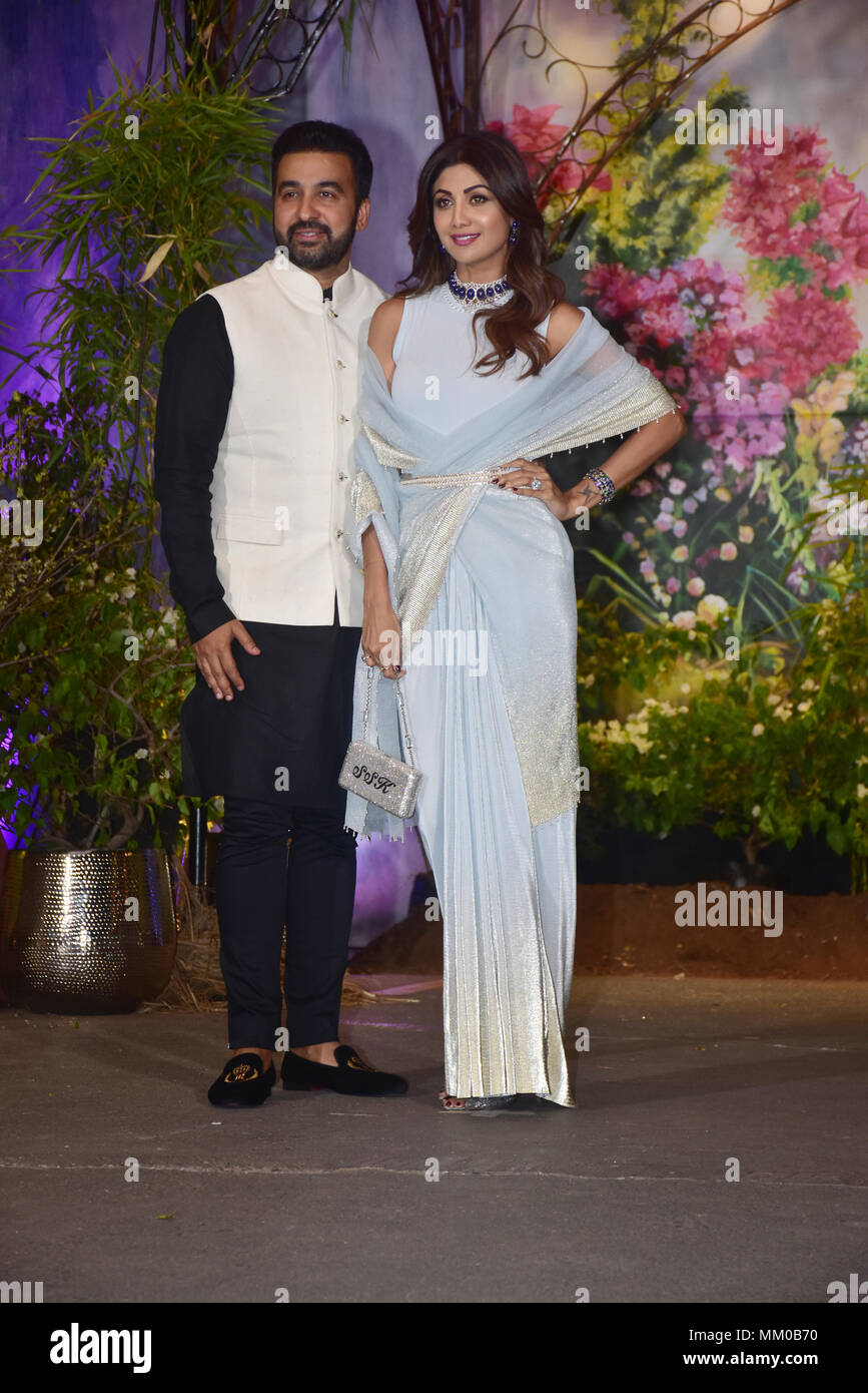 Indian film actress Shilpa Shetty Kundra with husband Raj Kundra attend the wedding reception of actress Sonam Kapoor and Anand Ahuja at hotel Leela in Mumbai. Stock Photo