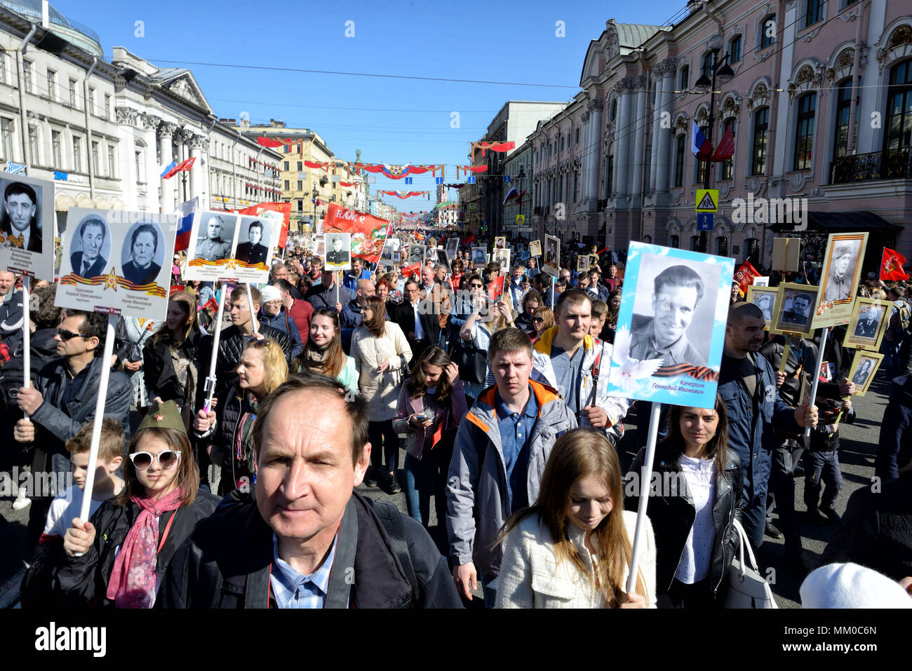 Immortal regiment - people carry banners with a photograph of their warrior ancestors, Victory Day, Nevsky Prospect, St. Petersburg, Russia Stock Photo