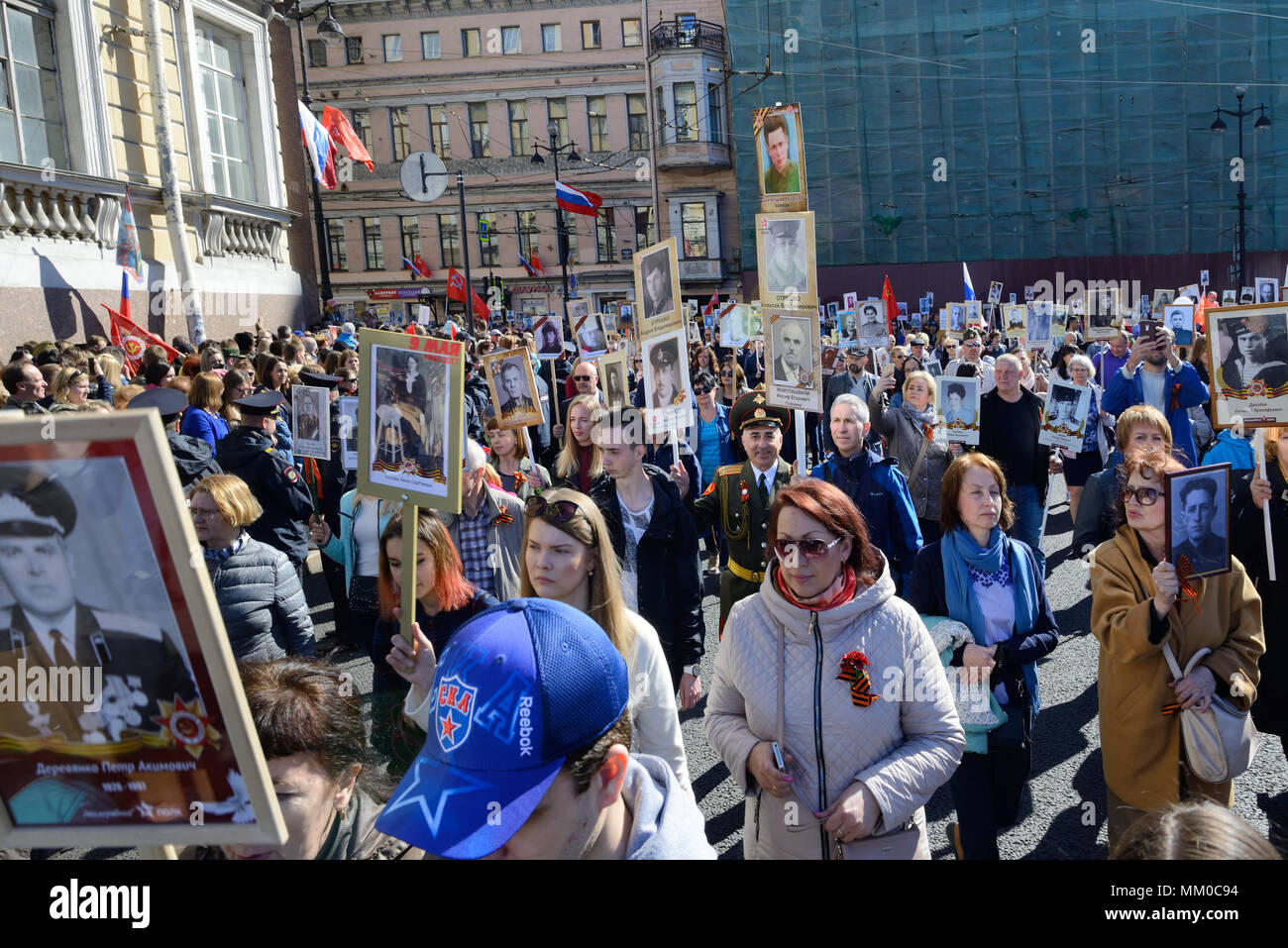 Immortal regiment - people carry banners with a photograph of their warrior ancestors, Victory Day, Nevsky Prospect, St. Petersburg, Russia Stock Photo
