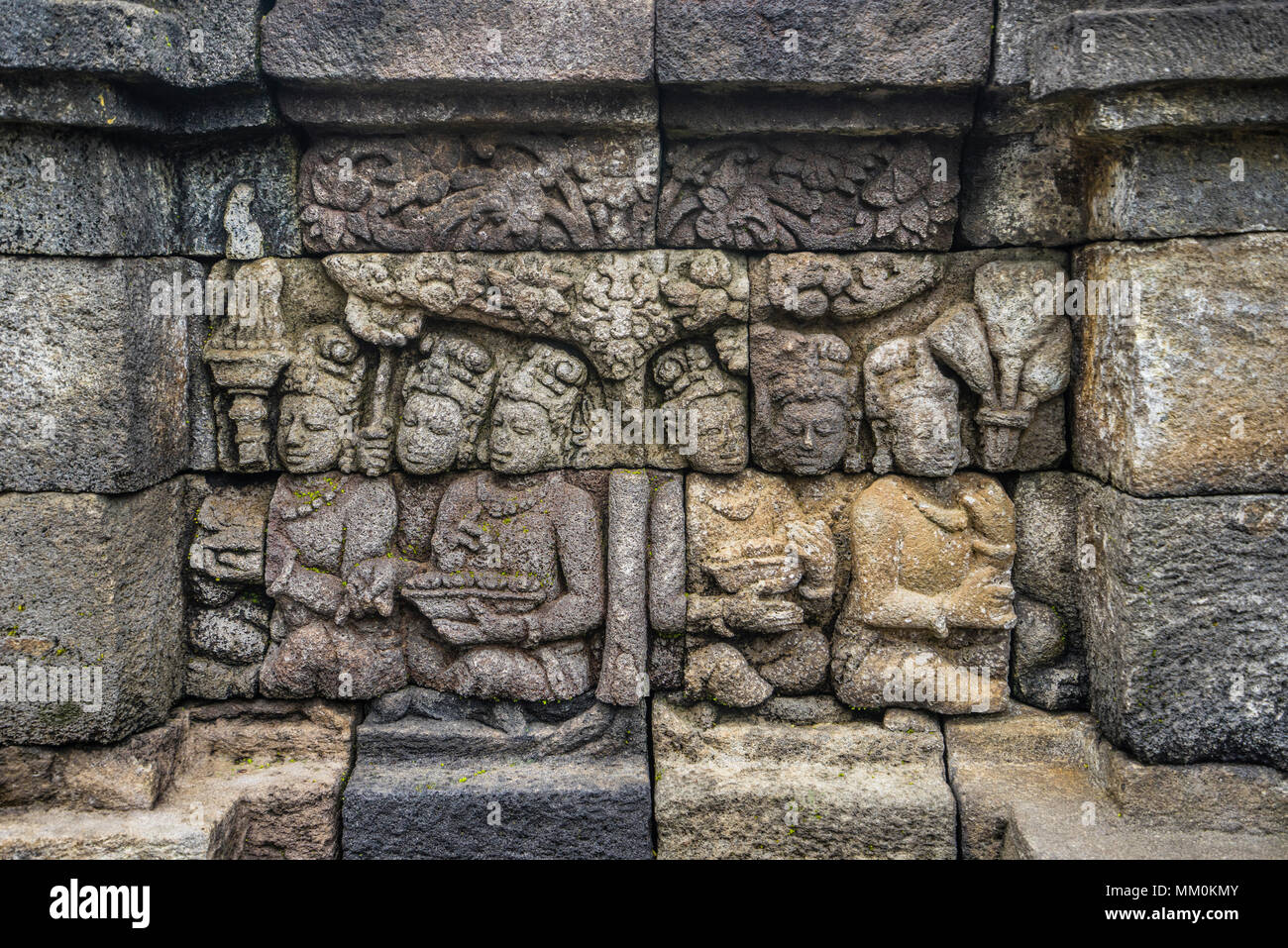 relief panels on the 4th balustrade of 9th century Borobudur Buddhist temple, the approximately 2672 panels form one of the most comprehensive Buddhis Stock Photo