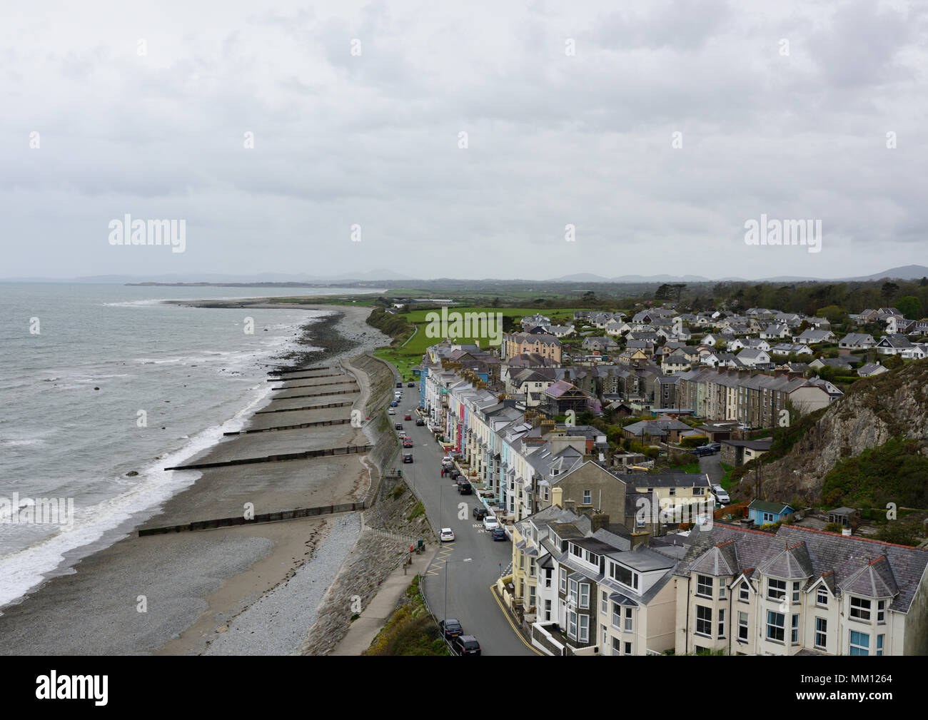 Aerial view of Criccieth seafront, street beach and sea in Cardigan bay