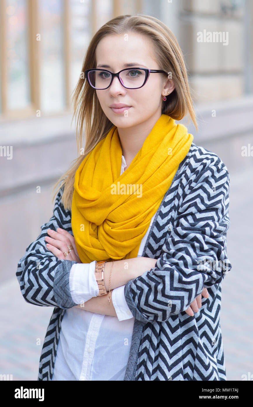 Young girl wearing a jacket and glasses. Portrait of a young girl Stock Photo